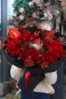 Luxurious red mix with Explorer roses in black packaging
