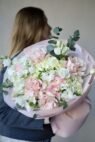 A delicate mix of hydrangeas, ranunculus and Pink Mondial roses